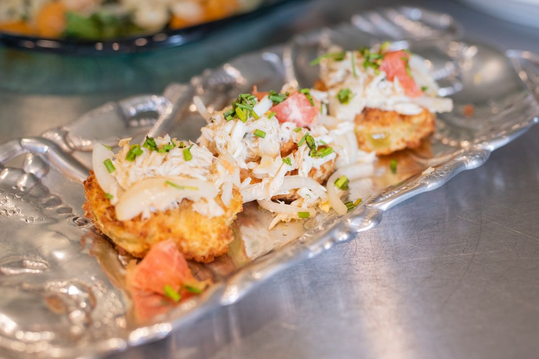 Fried green tomatoes topped with West Indies jumbo lump crab salad